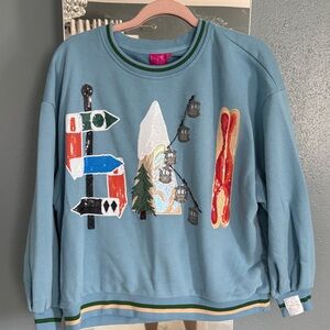 QUEEN OF SPARKLES Light Blue Graphic Ski Crewneck
